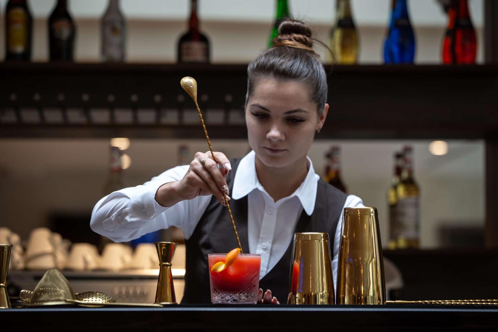 Radisson Blu Hotel & Residences Zakopane Zewnętrze zdjęcie A bartender stirring a drink